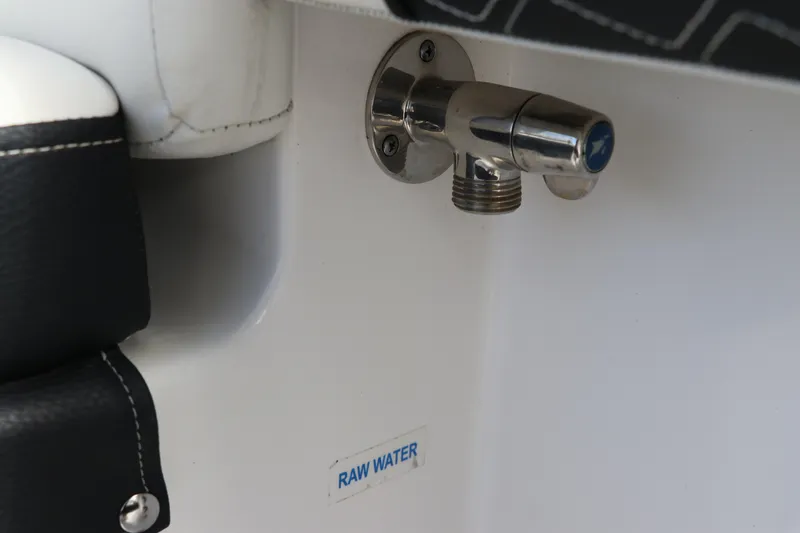 Slide: The Image of 2024 Tidewater 220 LXF raw water outlet detail with chrome finish. - 14