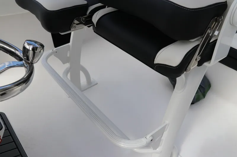Slide: The Image of 2024 Tidewater 220 LXF boat seating and footrest detail, featuring sleek design elements. - 22