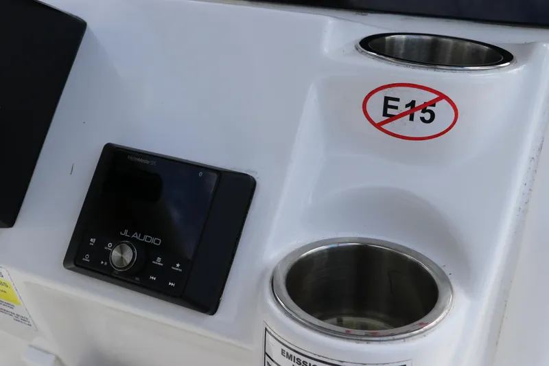 Slide: The Image of Control panel of 2024 Tidewater 220 LXF boat with JL Audio system and E15 fuel warning. - 26