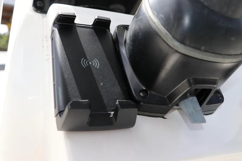 Slide: The Image of Close-up of a 2024 Tidewater 220 LXF boat's wireless charging station. - 29