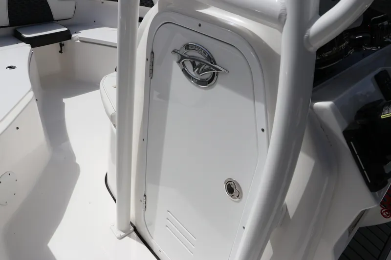 Slide: The Image of 2024 Tidewater 220 LXF boat interior with sleek white console and seating. - 33