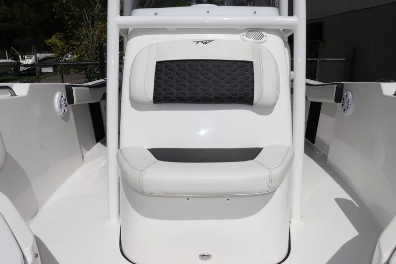 Slide: The Image of 2024 Tidewater 220 LXF boat interior with cushioned seating and sleek design. - 37