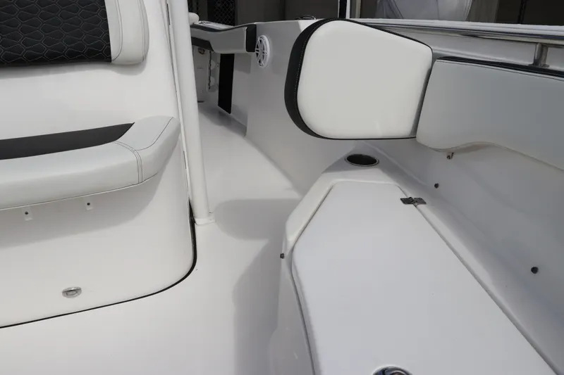 Slide: The Image of 2024 Tidewater 220 LXF boat interior with white seating and sleek design. - 50