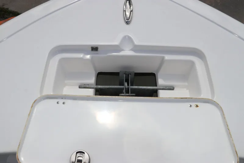 Slide: The Image of 2024 Tidewater 220 LXF boat anchor storage compartment, open view. - 52