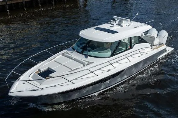 The Image of 2022 Tiara Sport 43 LE luxury boat cruising on water. - 0