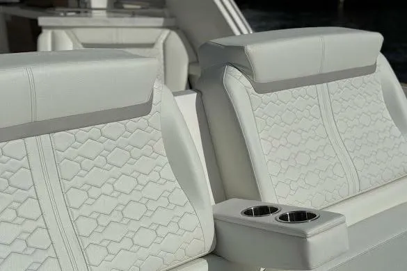 Slide: The Image of Luxurious seating on 2022 Tiara Sport 43 LE boat with elegant stitching and cup holders. - 11