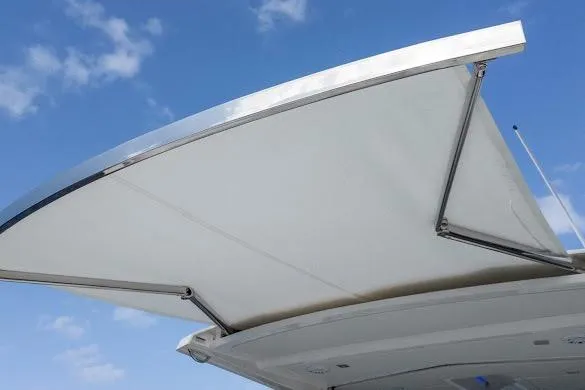 Slide: The Image of 2022 Tiara Sport 43 LE boat canopy against blue sky. - 15