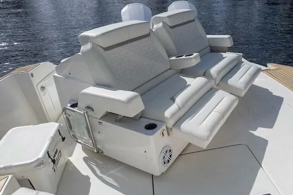 Slide: The Image of 2022 Tiara Sport 43 LE boat with luxurious white seating on deck. - 16
