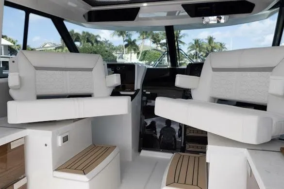 Slide: The Image of 2022 Tiara Sport 43 LE interior with luxurious seating and modern design. - 18