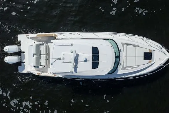 Slide: The Image of Aerial view of 2022 Tiara Sport 43 LE luxury yacht on water. - 2