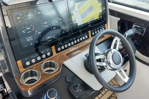 Slide: The Image of 2022 Tiara Sport 43 LE helm with advanced navigation displays and controls. - 21