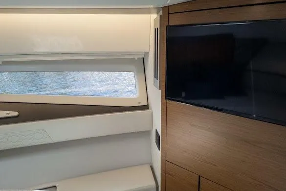 Slide: The Image of Interior of 2022 Tiara Sport 43 LE yacht with window and TV. - 28