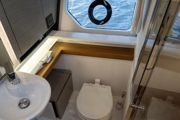 Slide: The Image of Luxurious 2022 Tiara Sport 43 LE yacht bathroom with modern fixtures and ocean view. - 30