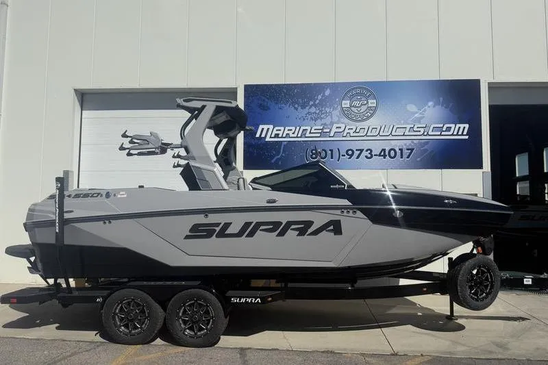 The Image of 2025 Supra SA 575 boat on trailer outside Marine-Products.com store. - 0