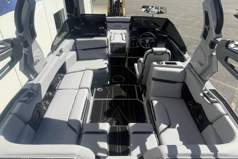 Slide: The Image of 2025 Supra SA 575 boat interior with luxurious seating and modern design. - 5