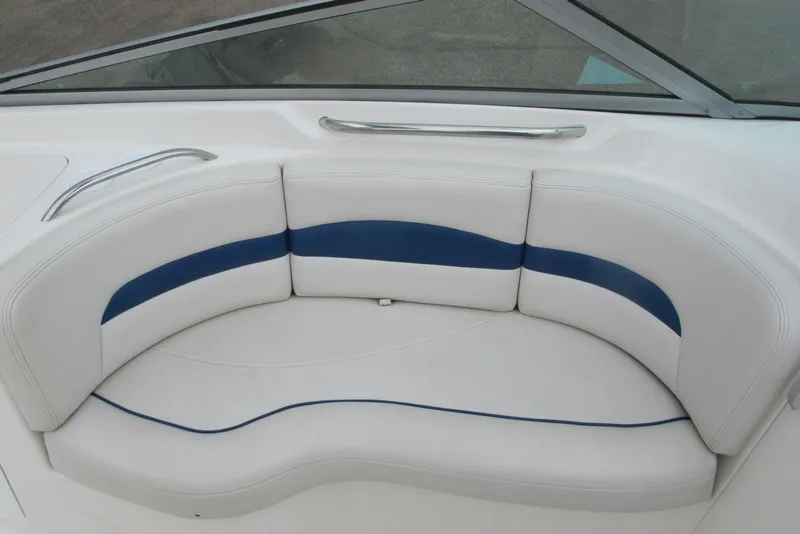 Slide: The Image of White and blue seating on 2003 Chaparral 280 SSi boat, featuring sleek design. - 11