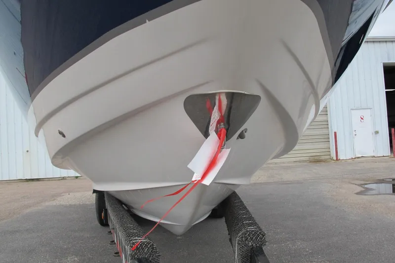 Slide: The Image of 2003 Chaparral 280 SSi boat on trailer, close-up of bow with red ribbons. - 3
