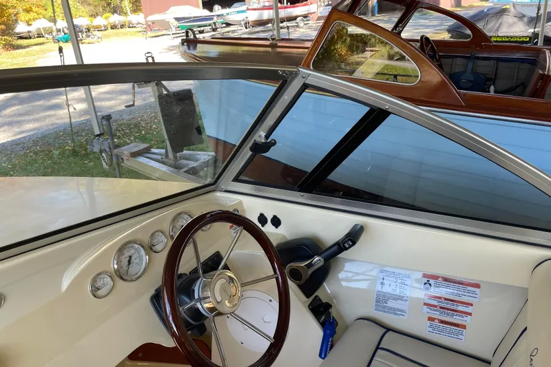 Slide: The Image of Interior view of 2020 Rossiter 20 Coastal Cruiser boat cockpit with steering wheel and gauges. - 11