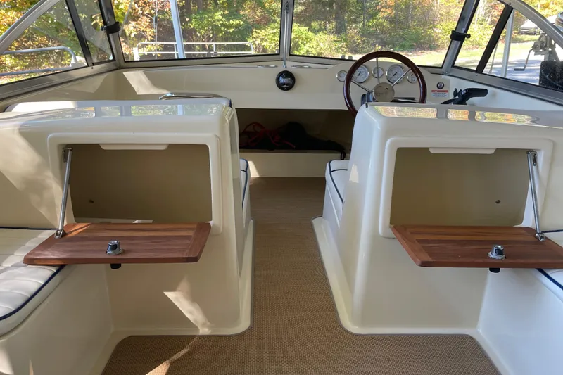 Slide: The Image of Interior of 2020 Rossiter 20 Coastal Cruiser with wooden accents and steering wheel. - 13