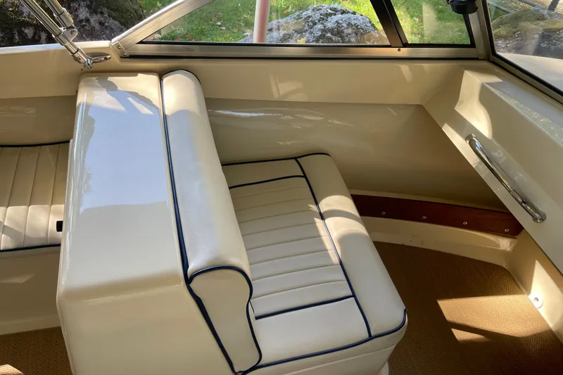 Slide: The Image of 2020 Rossiter 20 Coastal Cruiser interior with cream seating and blue trim. - 14