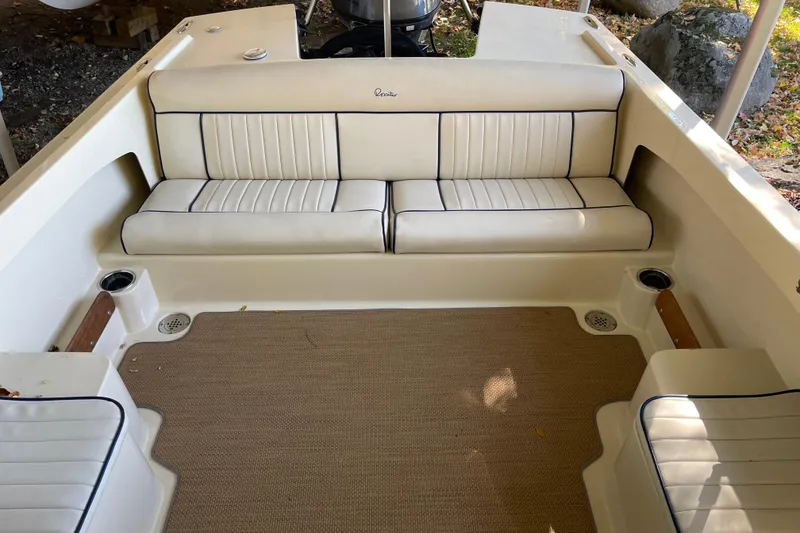 Slide: The Image of 2020 Rossiter 20 Coastal Cruiser interior with beige seating and carpeted floor. - 15