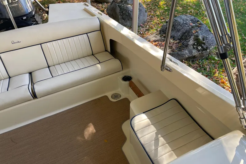 Slide: The Image of 2020 Rossiter 20 Coastal Cruiser interior with cushioned seating and stainless steel fixtures. - 16