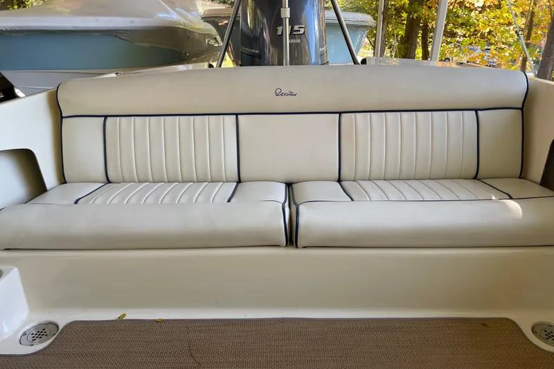 Slide: The Image of 2020 Rossiter 20 Coastal Cruiser boat interior with white cushioned seating. - 18