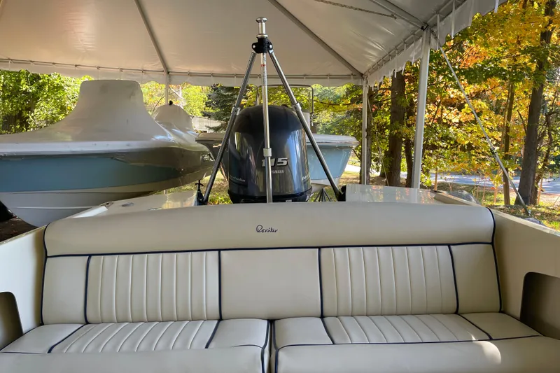 Slide: The Image of 2020 Rossiter 20 Coastal Cruiser under canopy with Yamaha outboard motor. - 19