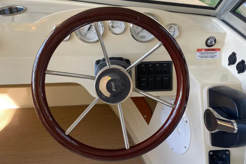 Slide: The Image of Steering wheel and dashboard of 2020 Rossiter 20 Coastal Cruiser boat. - 8