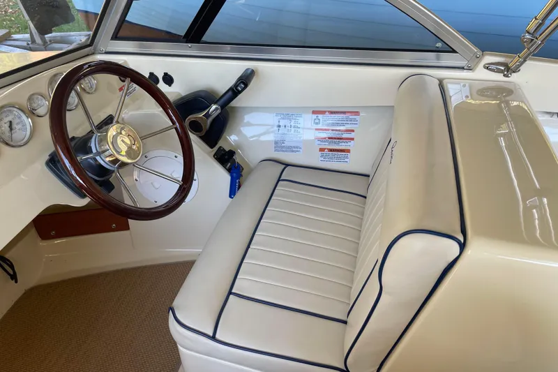 Slide: The Image of Interior of 2020 Rossiter 20 Coastal Cruiser with steering wheel and beige seating. - 9