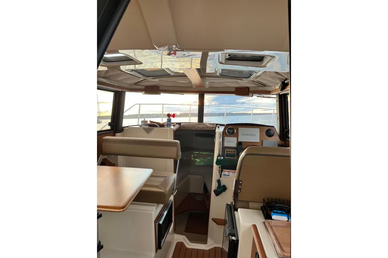 Slide: The Image of Interior of 2025 Ranger Tugs R23 boat with modern navigation equipment and seating. - 15