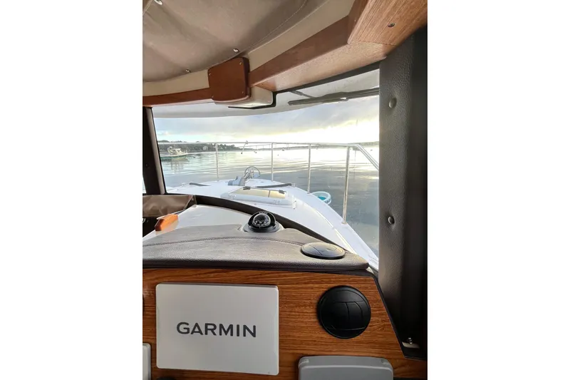 Slide: The Image of Interior view of 2025 Ranger Tugs R23 boat with Garmin navigation system. - 19