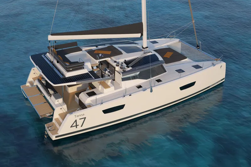 The Image of 2023 Fountaine Pajot Tanna 47 catamaran docked, showcasing sleek design and vibrant flags. - 1