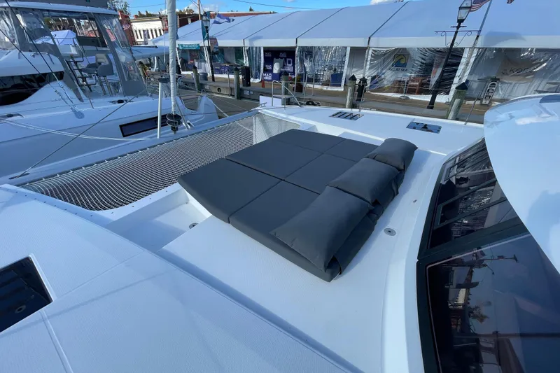 Slide: The Image of Luxurious 2023 Fountaine Pajot Tanna 47 catamaran with spacious deck and comfortable seating. - 13