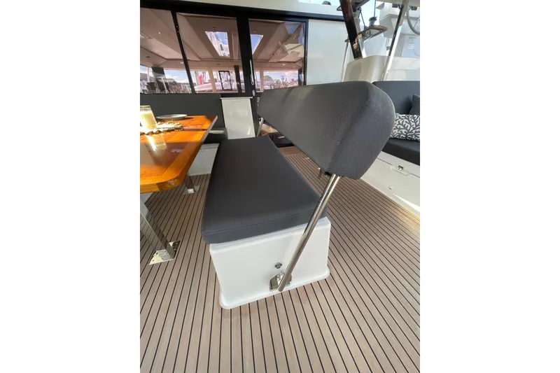 Slide: The Image of Interior seating area of 2023 Fountaine Pajot Tanna 47 yacht with wooden table. - 18