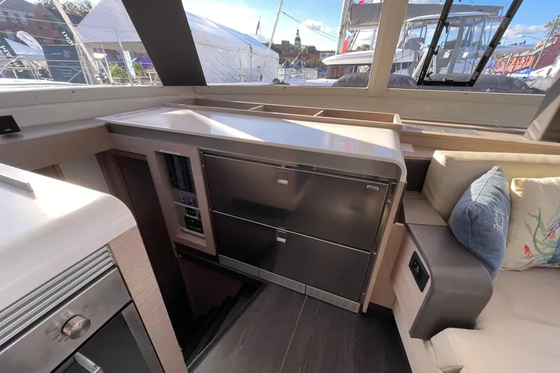 Slide: The Image of Interior of 2023 Fountaine Pajot Tanna 47 yacht with modern kitchen and seating area. - 6