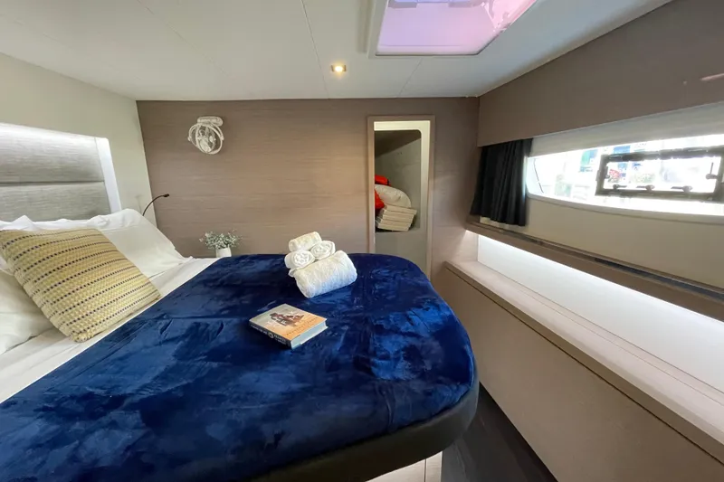 Slide: The Image of Luxurious cabin interior of 2023 Fountaine Pajot Tanna 47 yacht with plush bedding. - 8