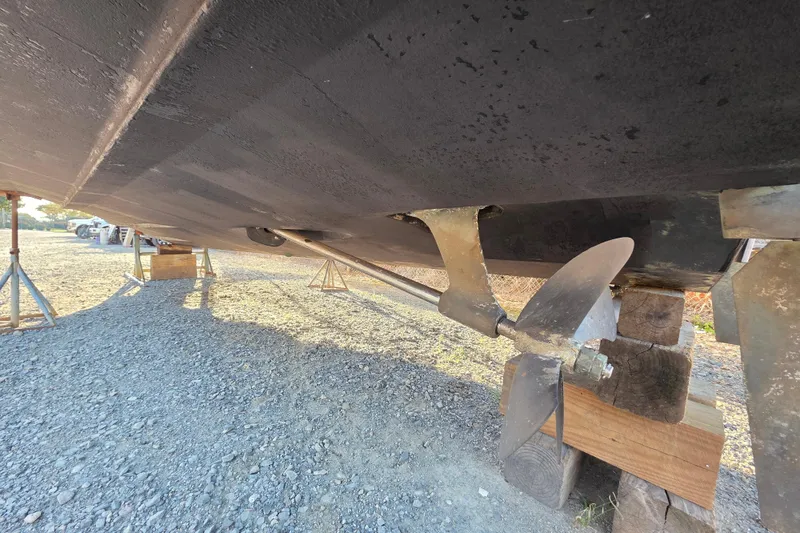 Slide: The Image of 1998 Maxum 3700 SCR boat propeller and hull on dry dock. - 11