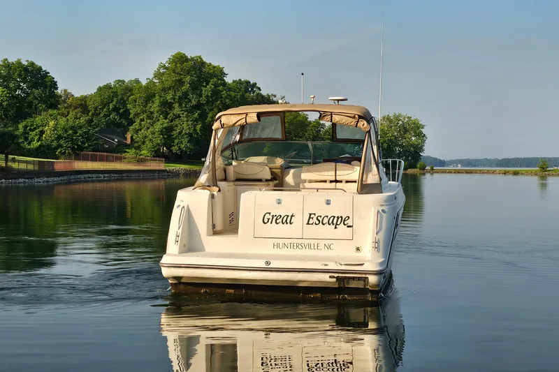 Slide: The Image of 1998 Maxum 3700 SCR boat named "Great Escape" on calm water, Huntersville, NC. - 2