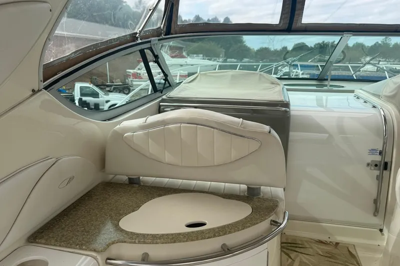 Slide: The Image of 1998 Maxum 3700 SCR yacht interior with elegant seating and countertop. - 22