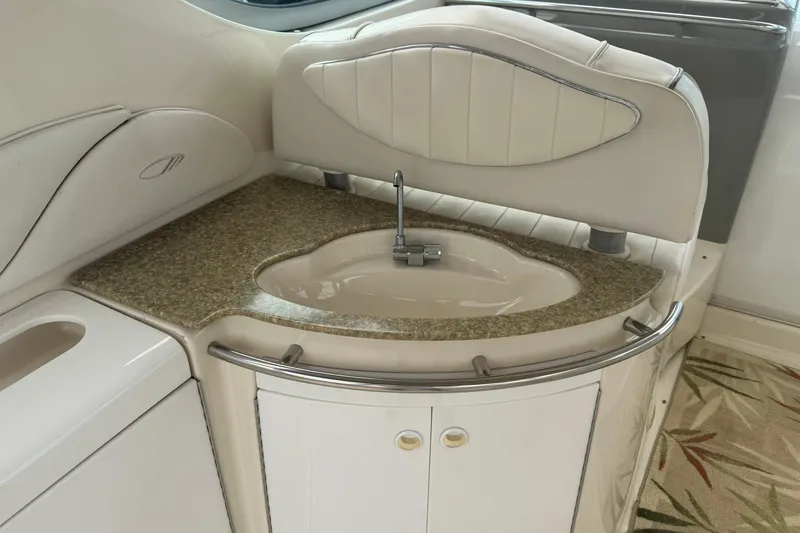 Slide: The Image of 1998 Maxum 3700 SCR yacht interior with elegant sink and countertop design. - 26