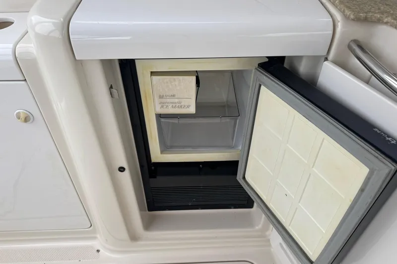 Slide: The Image of 1998 Maxum 3700 SCR boat with built-in U-Line automatic ice maker. - 27