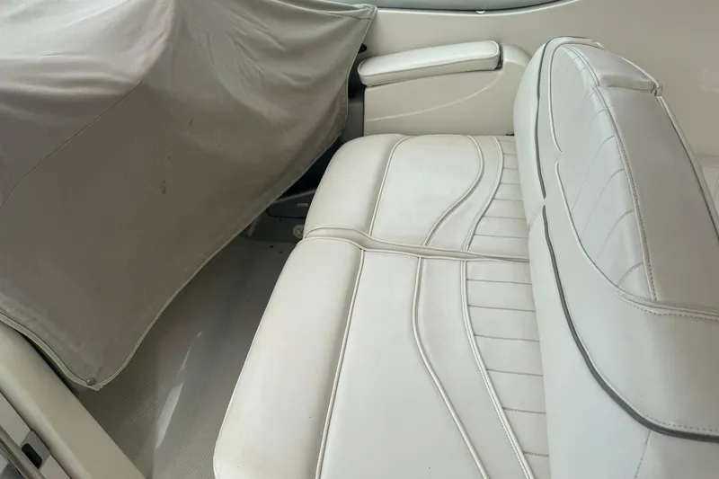 Slide: The Image of Interior seating of a 1998 Maxum 3700 SCR boat with white upholstery. - 29