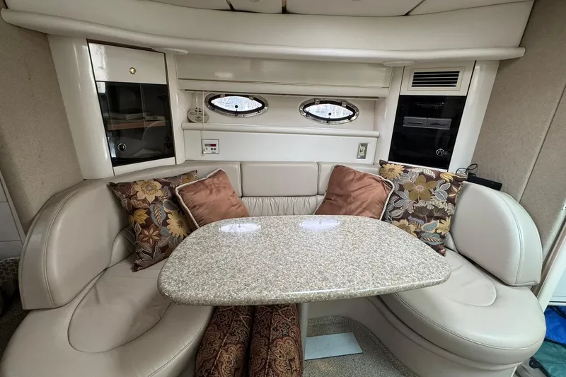 Slide: The Image of Luxurious interior of 1998 Maxum 3700 SCR yacht with plush seating and elegant decor. - 34