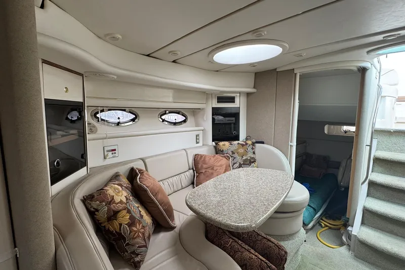Slide: The Image of Interior of 1998 Maxum 3700 SCR yacht with cozy seating and elegant decor. - 36