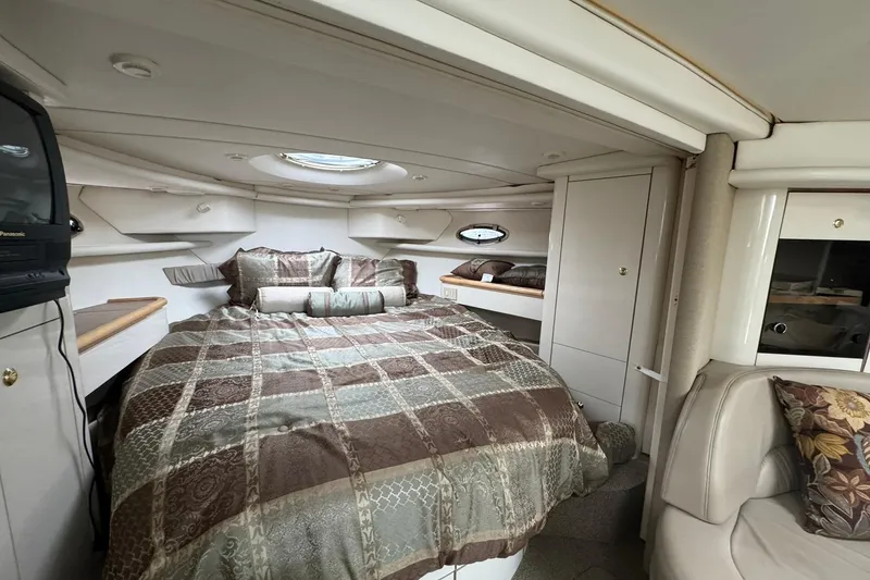 Slide: The Image of 1998 Maxum 3700 SCR cabin interior with cozy bed and elegant decor. - 38