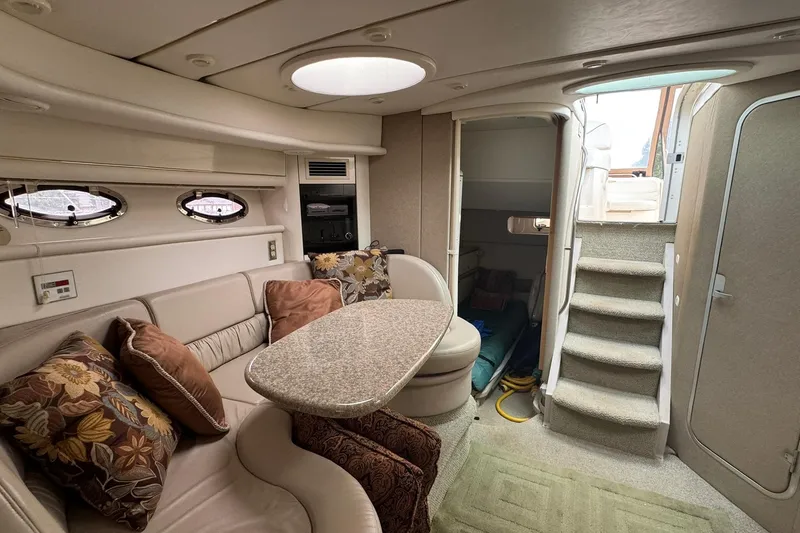 Slide: The Image of Luxurious interior of 1998 Maxum 3700 SCR yacht with plush seating and elegant decor. - 39