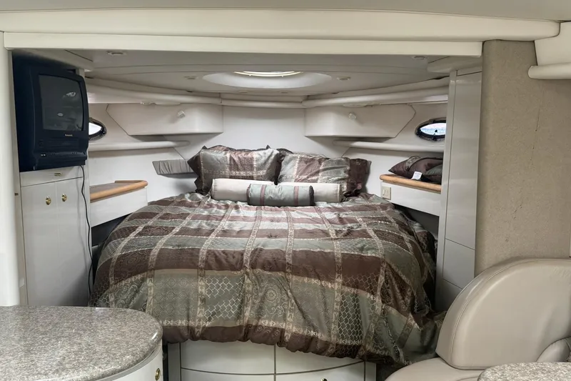 Slide: The Image of Cozy interior of 1998 Maxum 3700 SCR yacht with bed and TV. - 42
