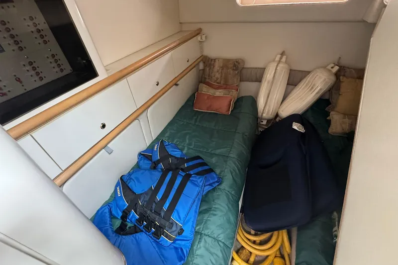 Slide: The Image of Interior cabin of 1998 Maxum 3700 SCR boat with life jackets and cushions. - 45