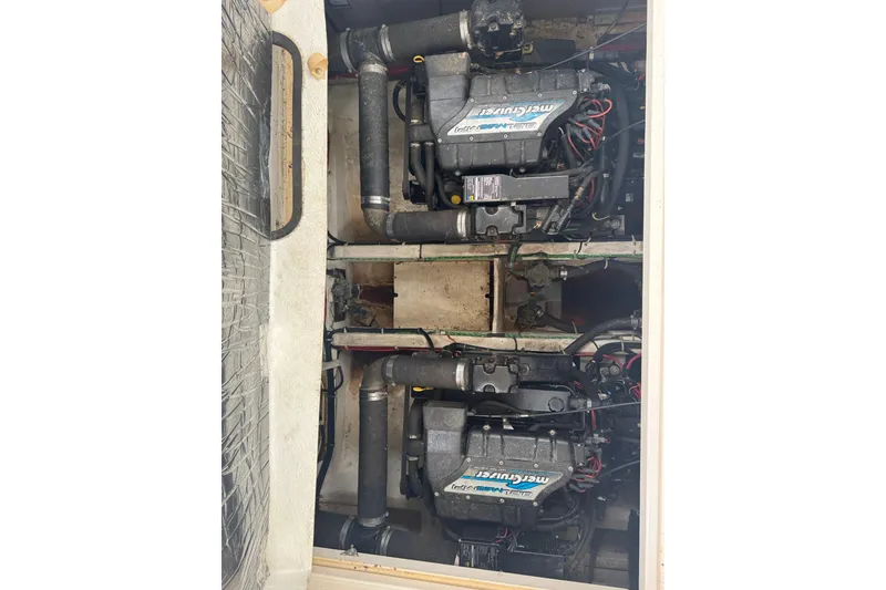Slide: The Image of Engine compartment of a 1998 Maxum 3700 SCR boat with twin MerCruiser engines. - 61